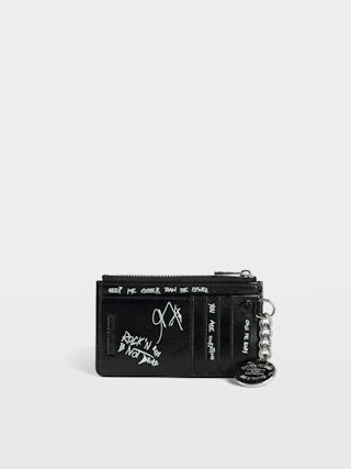 Sunny Card Holder - Card holder in vintage-effect patent leather with medallion and signature metal wings.