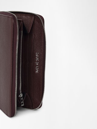 Compagnon Wallet - Grained leather wallet adorned with a wing charm.