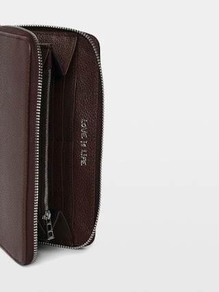 Compagnon Wallet - Grained leather wallet adorned with a wing charm.