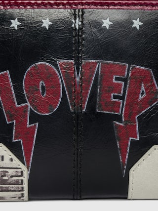 Sunny Mini Punk Geldbörse - Geldbörse aus Lackleder mit Vintage-inspiriertem Effekt, Medaillon und Flügel-Signaturen.