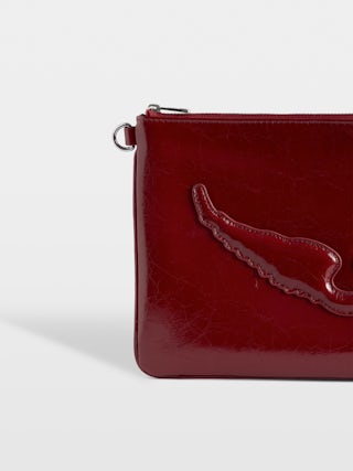 Angel Pouch - Pouch in patent leather adorned with embossed wings signature.