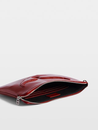 Angel Pouch - Pouch in patent leather adorned with embossed wings signature.