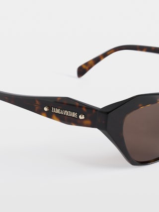Lunettes De Soleil ZV26S7 - Lunette de soleil unisexe en acétate avec détails logo et clous ailes sur branches.
