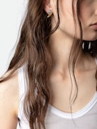 Boucles D'Oreilles Rock Feather - Boucles d'oreilles en forme d'ailes en laiton noirci et doré serti de cristaux.