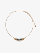 Rock Feather Necklace - Chain necklace with crystal-embellished wings pendant.