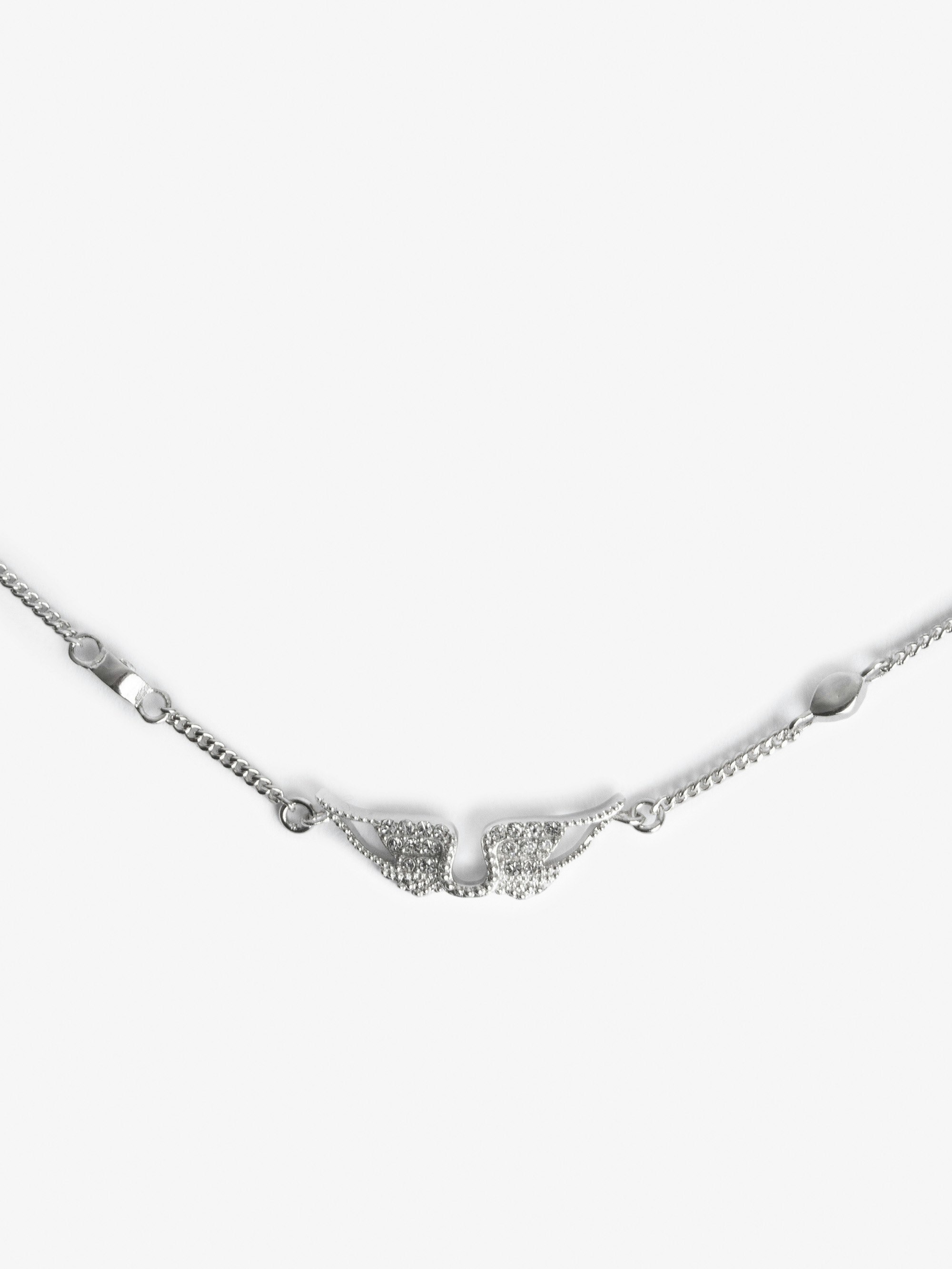 Rock Choker Necklace - Silver-tone brass necklace with inserts and wing pendant embellished with diamanté.