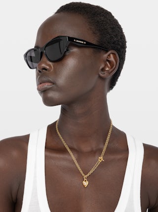 Necklace Heartbreaker - Gold-tone brass long necklace with heart pendant.