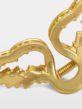 Haarspange Rock Hair - Haarspange aus gealtertem Goldmetall in Flügelform.