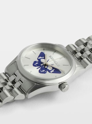 Zadig Small Watch - Stainless steel watch with silver dial featuring electric blue butterfly and steel bracelet.