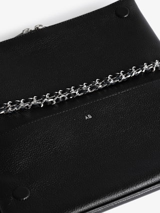 Rock Clutch - The iconic Rock women's leather clutch will take you seamlessly from day to evening.
It features a double chain and leather strap, so you can choose to wear it across the body or on the shoulder.