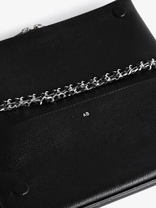 Rock Clutch - Grained leather clutch with double leather and metal chains and rhinestone-adorned wings.