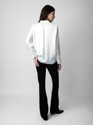 Tink Satin Blouse - Timeless and effortlessly chic, the Tink Satin Tunic is a wardrobe essential that exudes elegance. Crafted from flowing, lightweight satin, this satin tunic offers a refined yet relaxed silhouette. Designed with a Mao collar, buttoned cuffs, and delicate gathering details, it’s the perfect blend of sophistication and ease. Whether styled casually or dressed up, this versatile tunic is a must-have for any occasion.