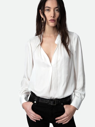 Tink Satin Blouse - Timeless and effortlessly chic, the Tink Satin Tunic is a wardrobe essential that exudes elegance. Crafted from flowing, lightweight satin, this satin tunic offers a refined yet relaxed silhouette. Designed with a Mao collar, buttoned cuffs, and delicate gathering details, it’s the perfect blend of sophistication and ease. Whether styled casually or dressed up, this versatile tunic is a must-have for any occasion.