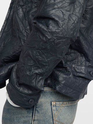 Loumy Leather Jacket - Clean crinkled leather jacket with zip closure, piped pockets and embossed wings signature on back.