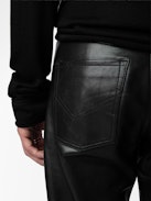John Leather Pants - Straight-leg smooth black leather pants with pockets and topstitching.
