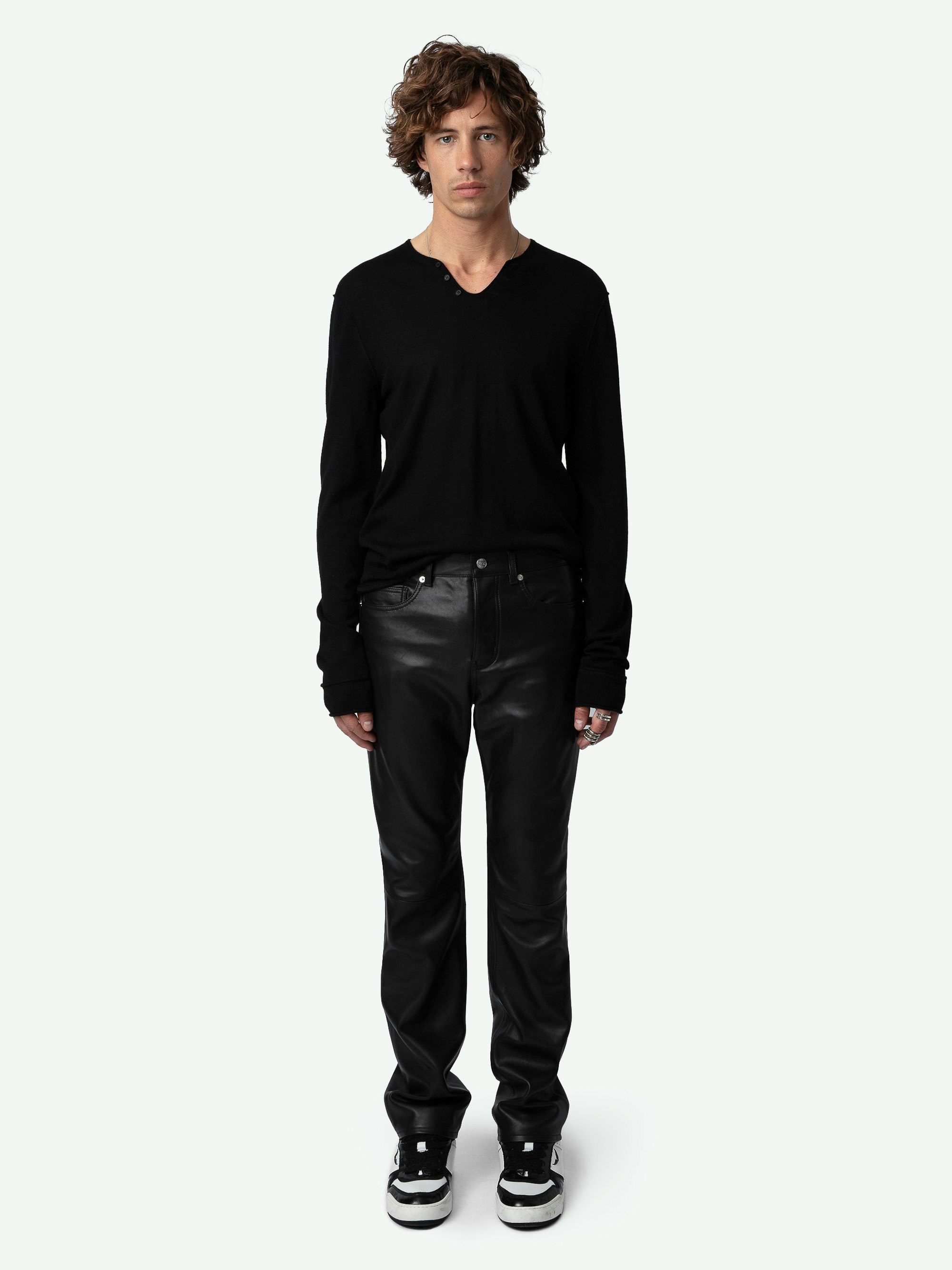 John Leather Pants - Straight-leg smooth black leather pants with pockets and topstitching.