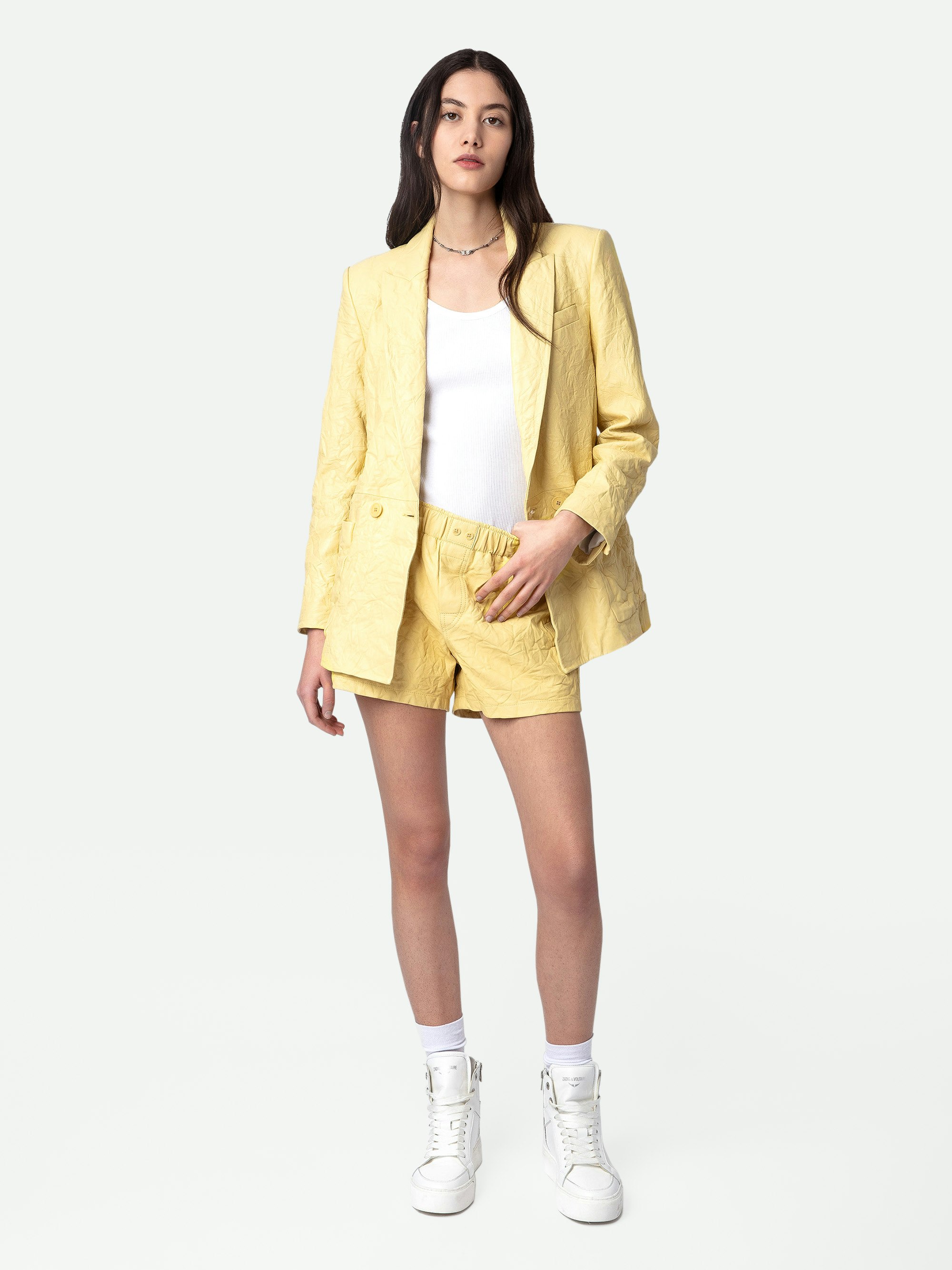 Pax Crinkled Leather Shorts - Women's light yellow crinkled leather shorts.