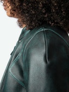 Loupa Leather Jacket - Long-sleeved short zipped jacket in dark green leather with protective collar.