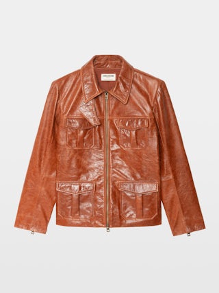 Blouson Lienna Cuir - Blouson en cuir glossy multi poches avec fermeture zippéee et ailes embossées dos.