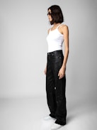 Evy Crinkled Leather Pants - Make a bold statement with the Evy flared black leather pants, crafted from Zadig&Voltaire’s signature crinkled leather. Designed with a flattering flared silhouette, these pants blend edgy sophistication with modern elegance. Featuring a button and zipper closure, along with functional pockets, they offer both style and versatility. Elevate your wardrobe with these standout flared black leather pants, perfect for day-to-night styling.