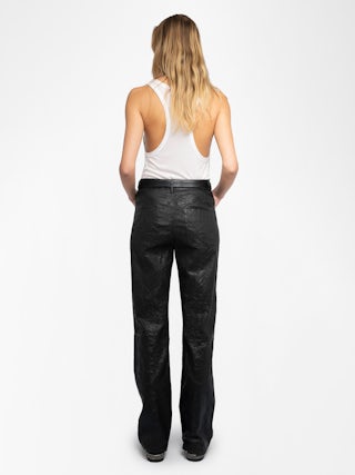 Evy Leather Pants - Make a bold statement with the Evy flared black leather pants, crafted from Zadig&Voltaire’s signature crinkled leather. Designed with a flattering flared silhouette, these pants blend edgy sophistication with modern elegance. Featuring a button and zipper closure, along with functional pockets, they offer both style and versatility. Elevate your wardrobe with these standout flared black leather pants, perfect for day-to-night styling.