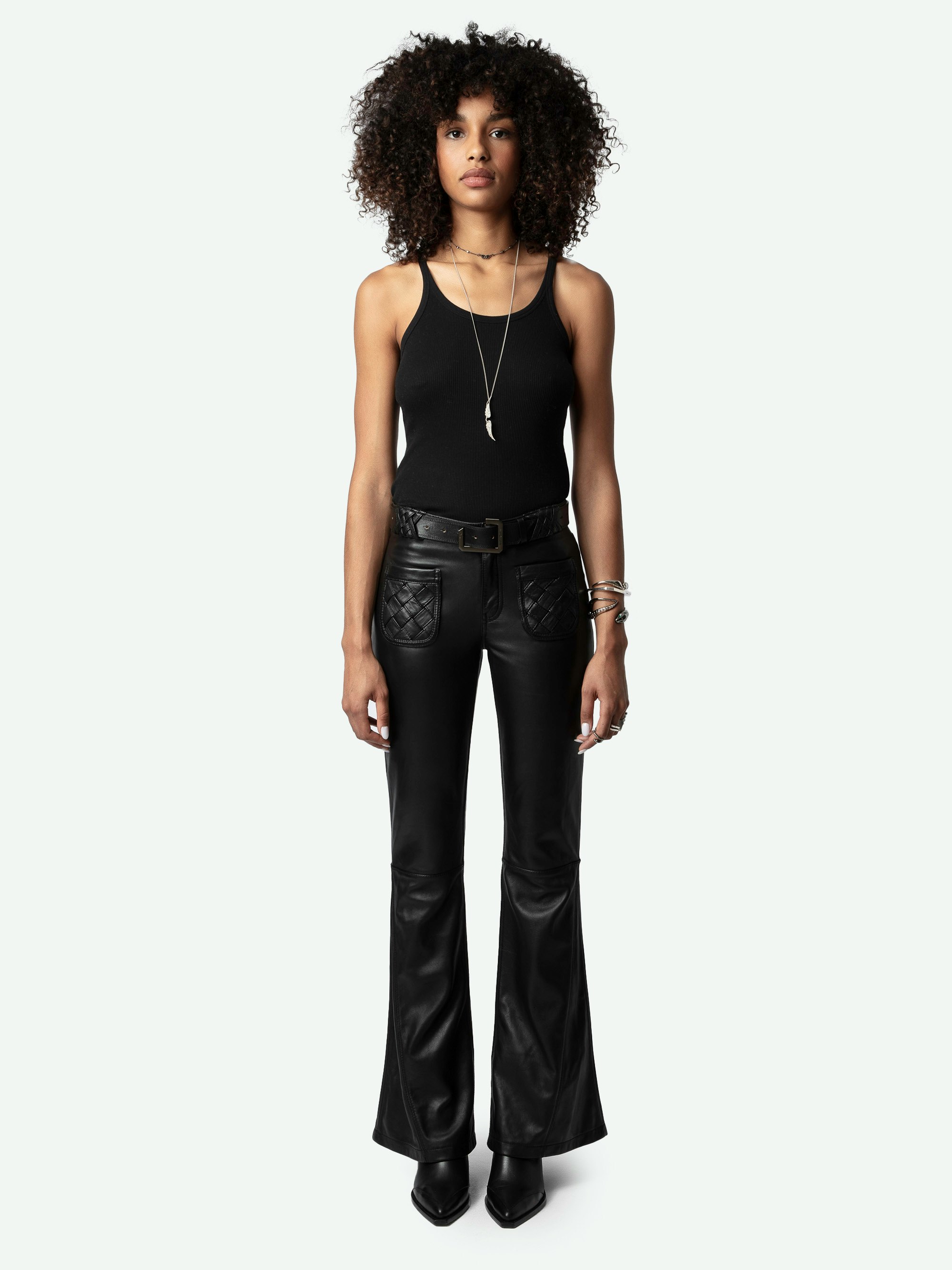 Ecume Leather Trousers - Flared trousers in smooth black leather with braided detailing on the pockets and belt loops.