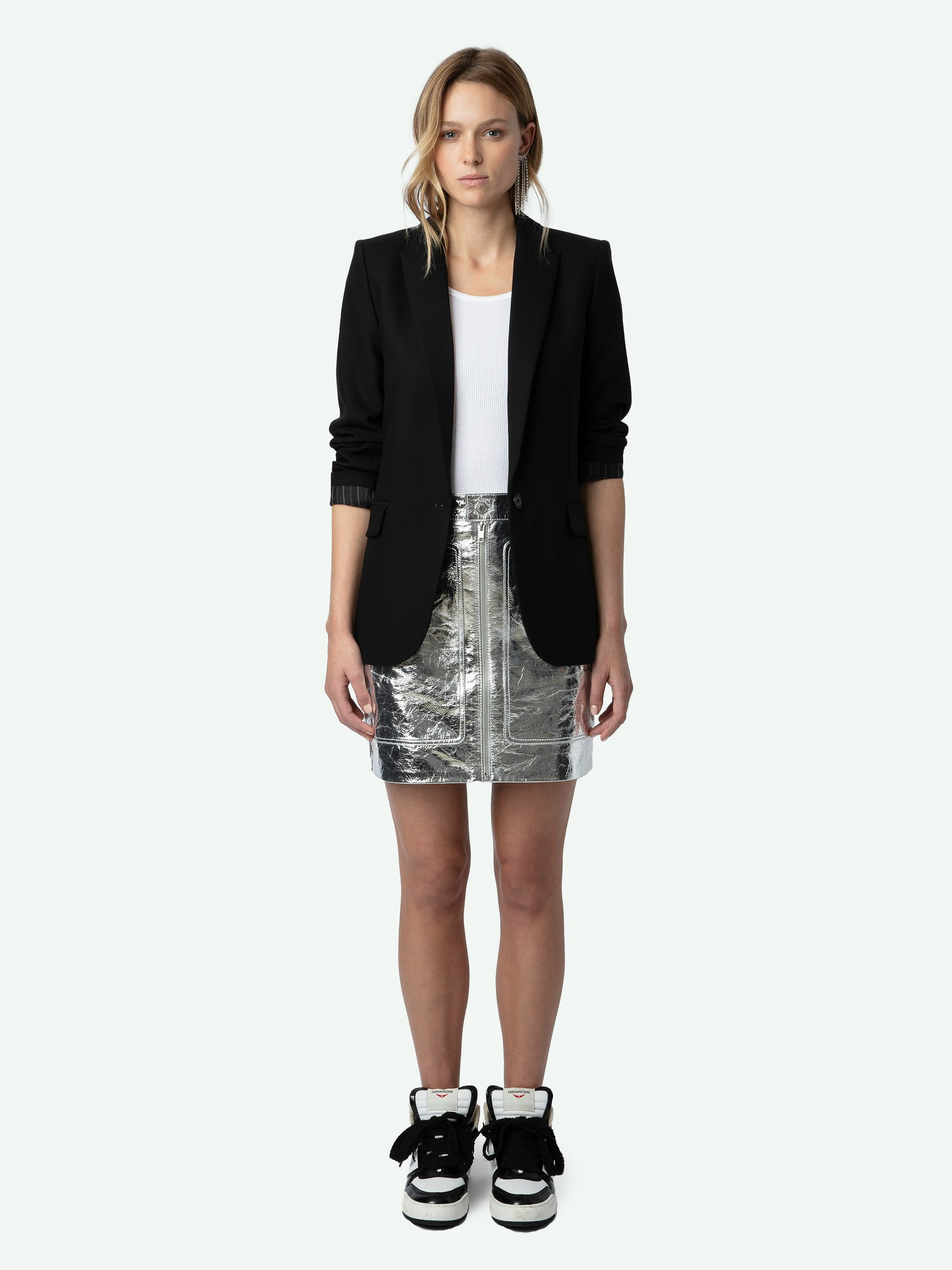 John Leather Skirt - Short leather skirt with metallic effect featuring zip closure, pockets and cut-out details.
