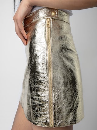 Jupe Jinette 100% Cuir - Jupe courte en cuir métallisé zippée.