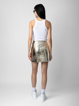 Jupe Jinette 100% Cuir - Jupe courte en cuir métallisé zippée.