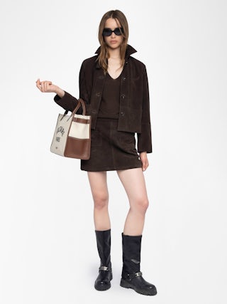 Jaime Suede Leather Skirt - Short suede leather skirt with applied pockets and back zip fastening.