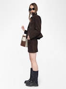Jaime Suede Leather Skirt - Short suede leather skirt with applied pockets and back zip fastening.