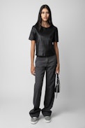 Tas Leather Top - Women’s black round-neck leather top with short sleeves.