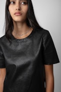 Tas Leather Top - Women’s black round-neck leather top with short sleeves.