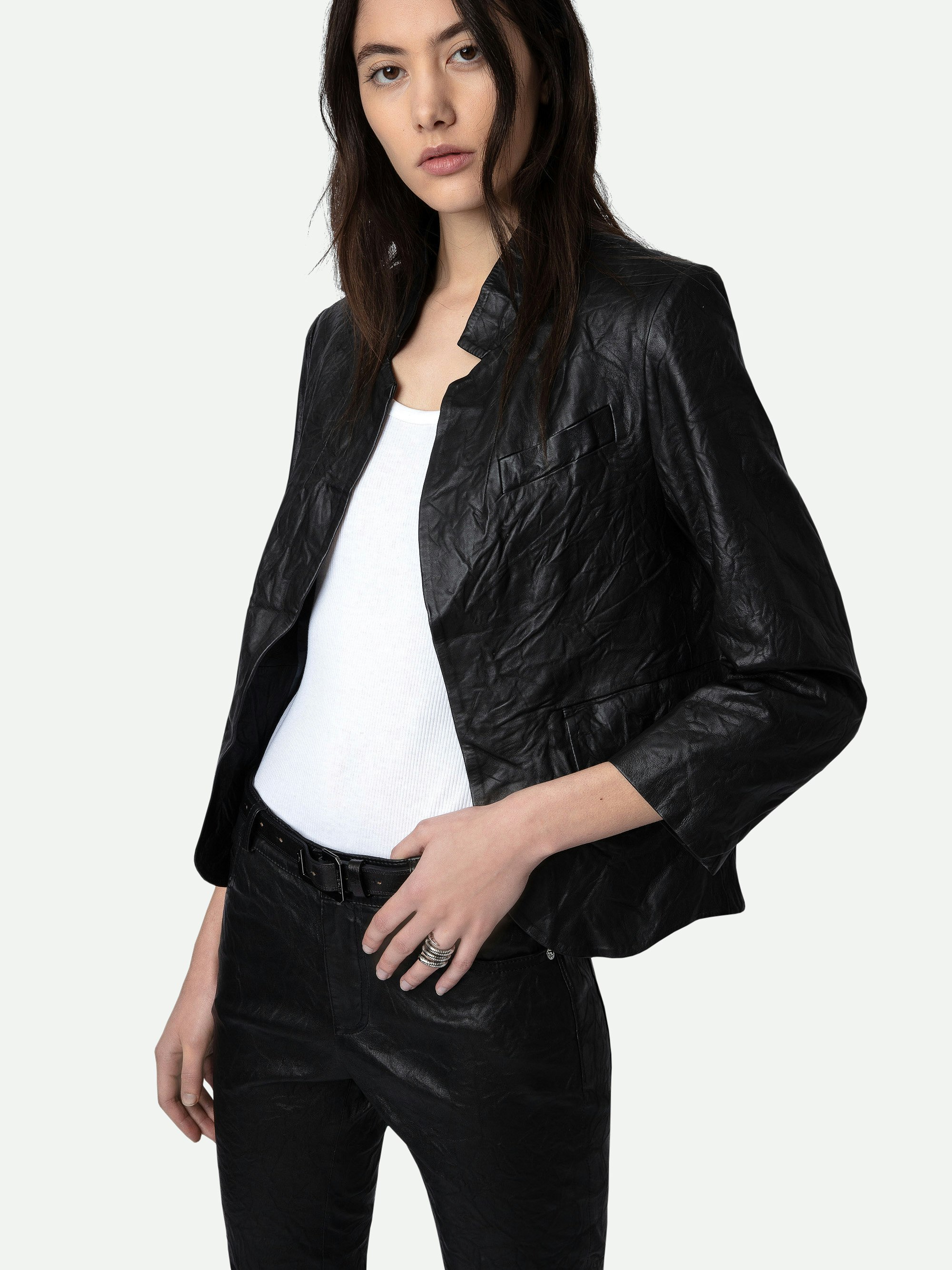 Verys Crinkled Leather Blazer - A timeless piece that embodies the brand's signature edgy elegance. Crafted from 100% lambskin, this black jacket features a distinctive crinkled texture, offering a unique twist on classic leather outerwear. Its straight cut and high collar provide a sleek silhouette, making it a versatile addition to any wardrobe.