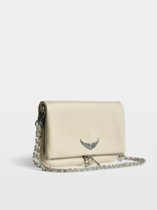 Rock Clutch - Clutch in grained leather with double leather and metal chains and wings adorned with rhinestones.