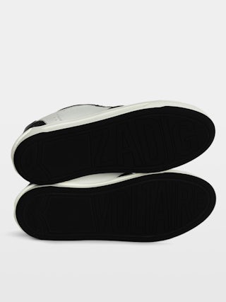 Men's Low-Top Wings Trainers - Low-top trainers in smooth white leather, with smooth black leather and vintage black leather inserts, wing signatures. These trainers are made with materials that have a reduced environmental impact.