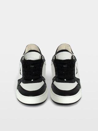 Men's Low-Top Wings Trainers - Low-top trainers in smooth white leather, with smooth black leather and vintage black leather inserts, wing signatures. These trainers are made with materials that have a reduced environmental impact.