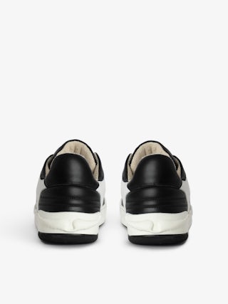 Wings Low-Top Sneakers - Low-top sneakers in smooth black and white leather with suede panels and signature wings.