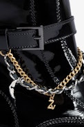 Laureen High Ankle Boots - Women’s patent black leather ankle boots with strap, double metal and gold-tone chain and charms