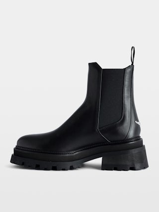 Ride Chelsea Boots - Women’s black semi-patent smooth leather Chelsea boots with wings charm.