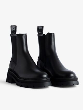 Ride Chelsea Boots - Women’s black semi-patent smooth leather Chelsea boots with wings charm.