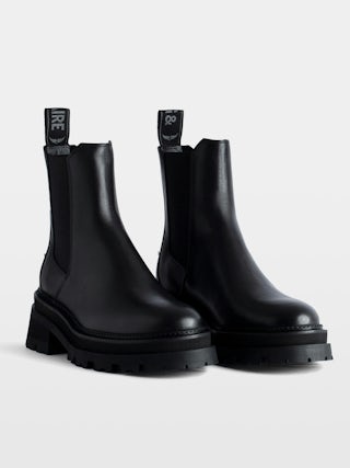 Ride Chelsea Boots - Women’s black semi-patent smooth leather Chelsea boots with wings charm.