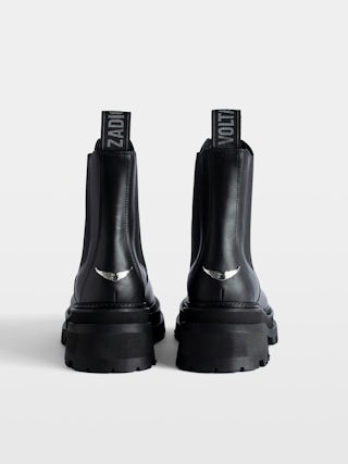 Ride Chelsea Boots - Women’s black semi-patent smooth leather Chelsea boots with wings charm.