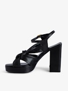 Forget Me Knot Sandals - Women’s black leather high-heeled sandals with strap and bow.