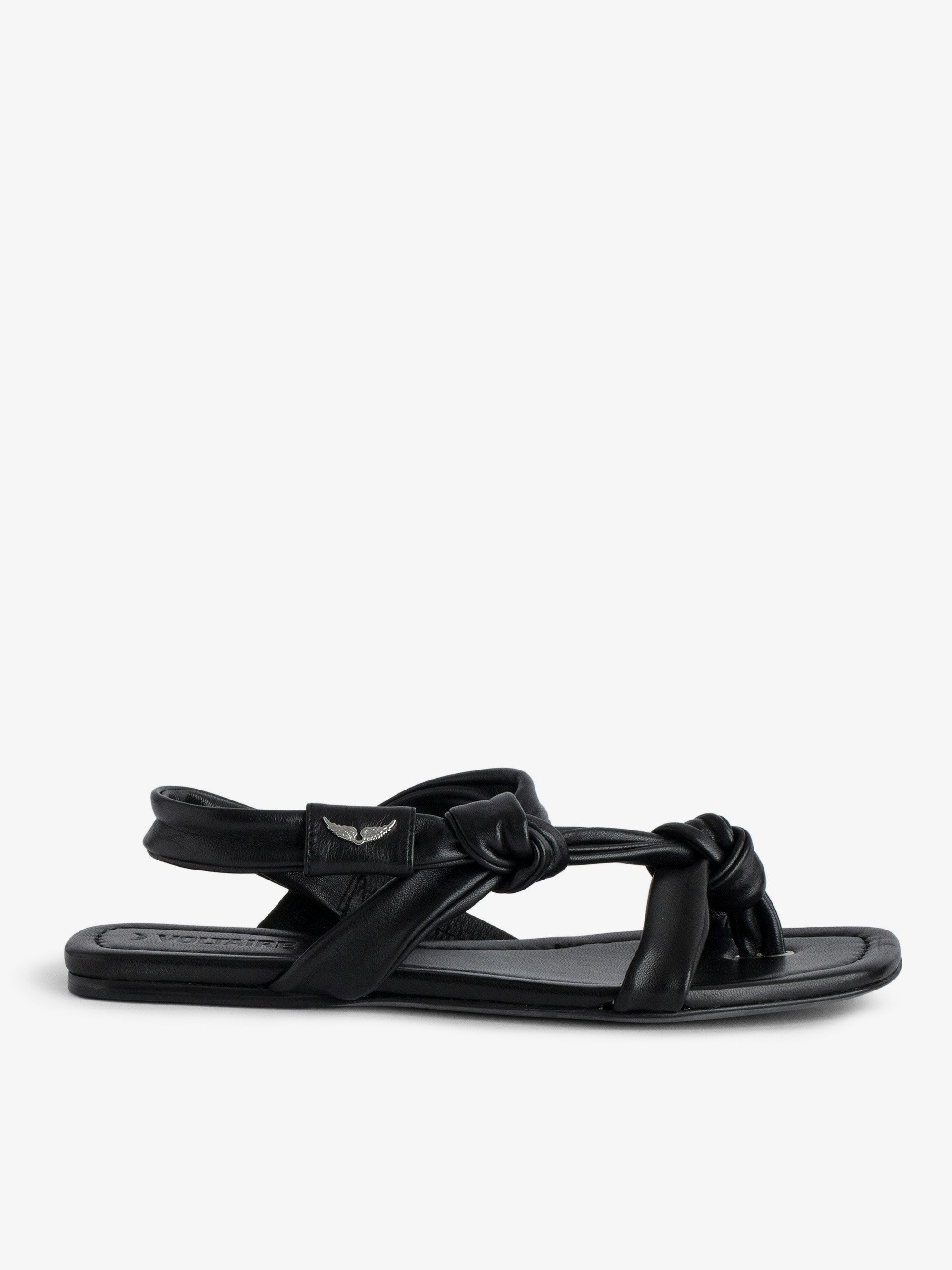 Forget Me Knot Sandals - Women's black  flat leather sandals with wing motifs.