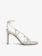Alana Sandals - Women's white smooth leather heeled sandals with tied straps and charms.