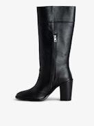 Preiser Tall Boots - Women's black tall leather boots with wings charm on calves.