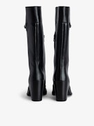 Preiser Tall Boots - Women's black tall leather boots with wings charm on calves.