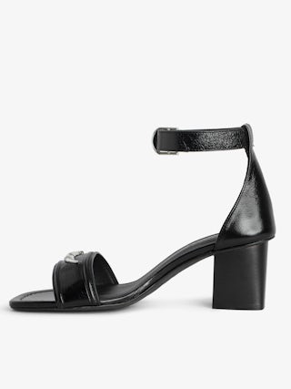 Caprese Sandals - Heeled sandals with leather strap adorned with a wing charm and a signature buckle.