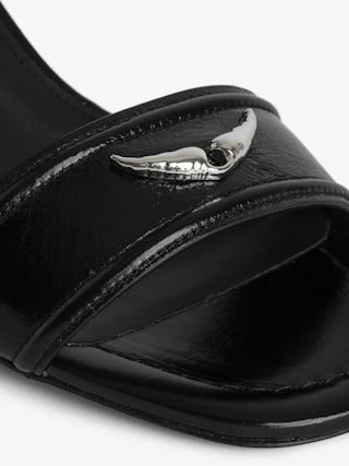 Caprese Sandals - Heeled sandals with leather strap adorned with a wing charm and a signature buckle.